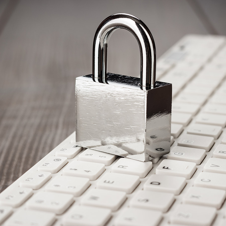 managed IT security services, metal lock on keyboard